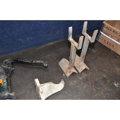 1068 - A VINTAGE CAST IRON PUMP, two bespoke metal stands, and a cast metal wall hanging item, labelled 7 1... 