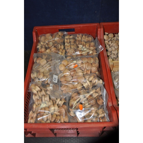 1073 - THREE TRAYS AND A BAG, containing a large quantity of pine drawer/doorknobs, varying in sizes (4)