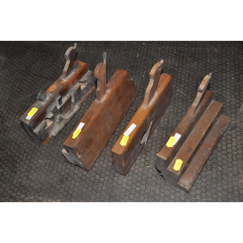 1077 - FOUR VARIOUS VINTAGE WOODEN PLANES, along with a PW Walker number 3 adze tool (5)