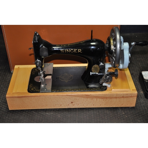 1079 - A LEATHER CASED MANUAL SINGER SEWING MACHINE, serial number 15 040 687, an Avometer 8 in original ca... 