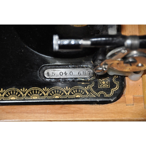 1079 - A LEATHER CASED MANUAL SINGER SEWING MACHINE, serial number 15 040 687, an Avometer 8 in original ca... 