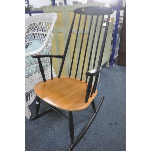 1211 - AN ERCOL STYLE EBONISED ROCKING CHAIR, along with a wicker armchair (condition report: good) (2)