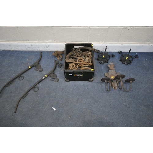 1231 - A BOX CONTAINING VINTAGE RUSTED HORSE TACK, including a pair of horse Hames, a wall mounted candle h... 