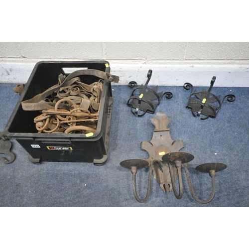 1231 - A BOX CONTAINING VINTAGE RUSTED HORSE TACK, including a pair of horse Hames, a wall mounted candle h... 