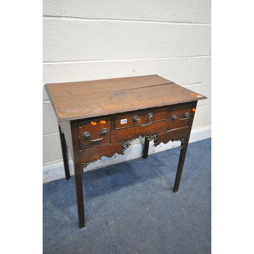 1239 - A GEORGIAN OAK LOWBOY, with three drawers, brass swan neck handles, open fretwork apron, on square l... 