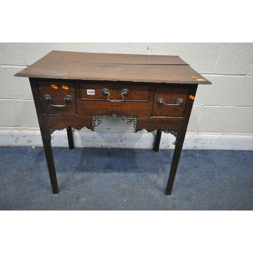 1239 - A GEORGIAN OAK LOWBOY, with three drawers, brass swan neck handles, open fretwork apron, on square l... 