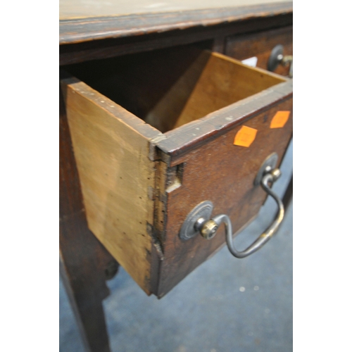 1239 - A GEORGIAN OAK LOWBOY, with three drawers, brass swan neck handles, open fretwork apron, on square l... 