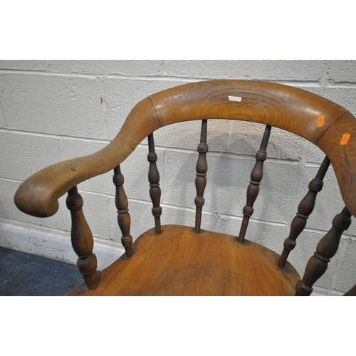 1241 - A 19TH CENTURY ELM DESK ARMCHAIR, with turned spindles, and stretchers (condition report: aged wear ... 