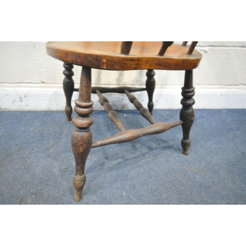 1241 - A 19TH CENTURY ELM DESK ARMCHAIR, with turned spindles, and stretchers (condition report: aged wear ... 