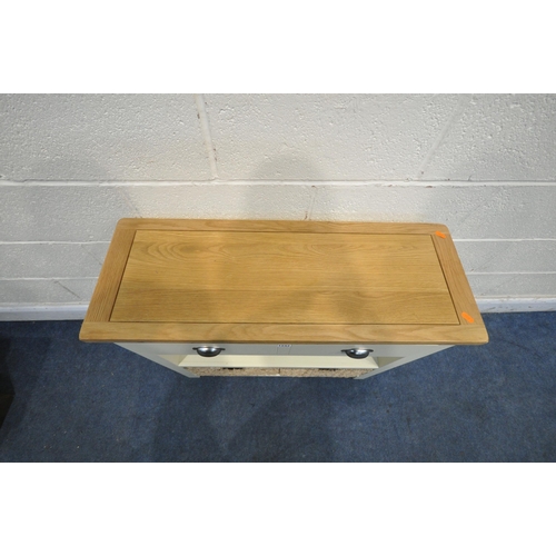 1243 - A MODERN PAINTED AND OAK SIDE TABLE, with a single long drawer, and two wicker baskets, width 82cm x... 