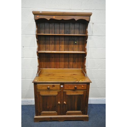 1245 - A MODERN PINE DRESSER, with two drawers, width 98cm x depth 49cm x height 187cm x height of base 79c... 