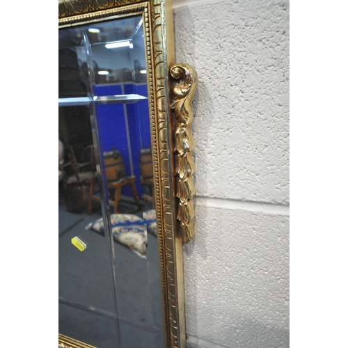 1258 - A FRENCH GILT FRAMED WALL MIRROR, with an ewer pediment, 98cm x 77cm, another foliate gilt framed wa... 