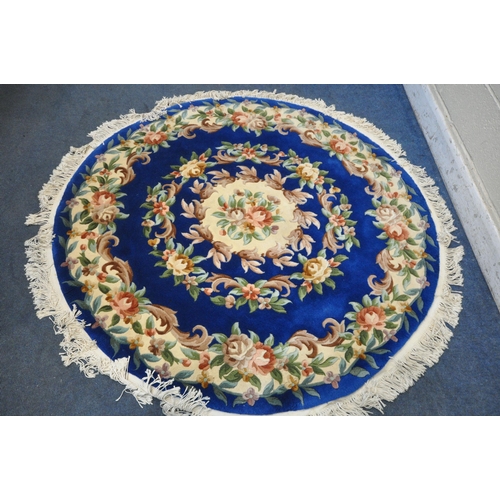 1259 - A BLUE CHINESE CIRCULAR WOOLLEN RUG, diameter, 160cm (condition report: good)