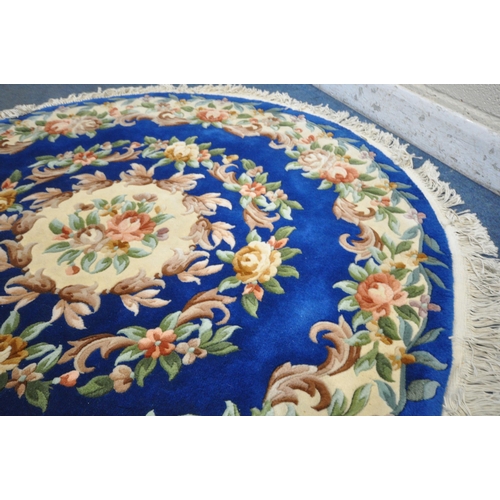 1259 - A BLUE CHINESE CIRCULAR WOOLLEN RUG, diameter, 160cm (condition report: good)