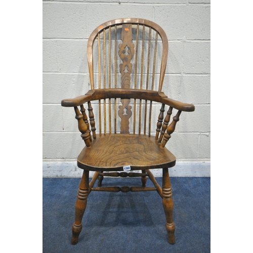 1260 - AN ELM AND BEECH HOOP BACK ARMCHAIR, with a pierced splat back, width 67cm x depth 67cm x height 120... 