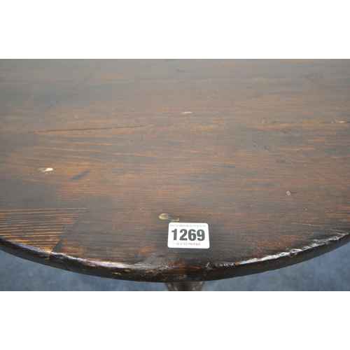 1269 - AN ELM AND PINE CRICKET TABLE, incorporating older timbers, the later circular top, on triple legs, ... 