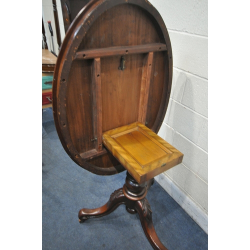 1273 - A VICTORIAN MAHOGANY OVAL TILT TOP LOO TABLE, with turned support, on three legs with leaf detail, l... 