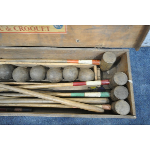 1280 - A VINTAGE PINE BOXED CROQUET SET, the lid reading Jeu De Croquet, width 102cm x depth 29cm x height ... 