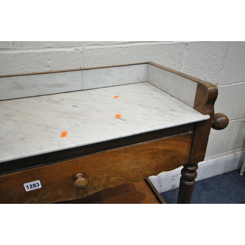 1283 - A VICTORIAN FLAME MAHOGANY WASHSTAND, with a marble top and gallery, towel rails flanking a single d... 