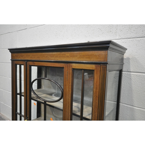 1284 - AN EDWARDIAN MAHOGANY ASTRAGAL GLAZED SINGLE DOOR DISPLAY CABINET, on square tapered legs, united by... 