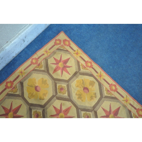 1295 - A 1970'S WOOL RUG, with a repeating pattern, 242cm x 197cm (condition report: in need of minor clean... 