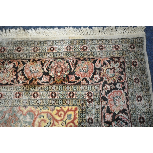 1303 - A LARGE 2OTH CENTURY KASHAN CREAM AND BLUE FIELD SILK RUG, 314cm x 212cm (condition report: in need ... 