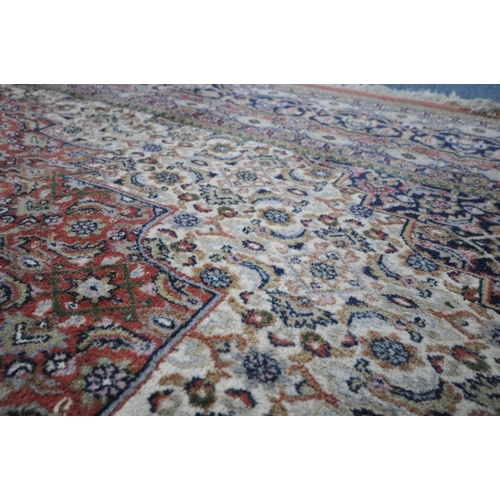 1305 - A LARGE 20TH CENTURY BIDJAR WOOL RUG, with red, cream and blue field, central medallion, and multi s... 