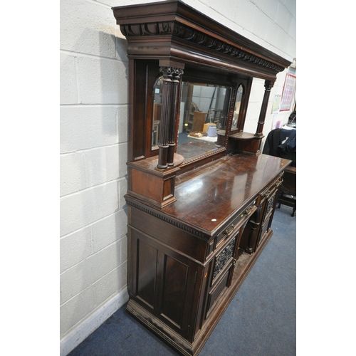 1307 - AN EDWARDIAN MAHOGANY MIRRORBACK SIDEBOARD, the top with an overhanging cornice, supported by pillar... 