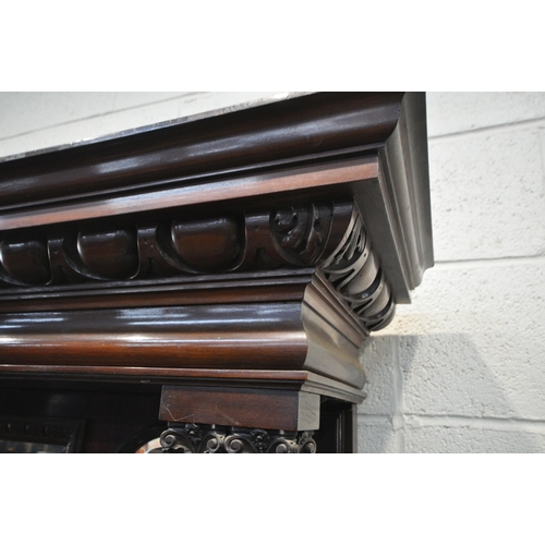 1307 - AN EDWARDIAN MAHOGANY MIRRORBACK SIDEBOARD, the top with an overhanging cornice, supported by pillar... 