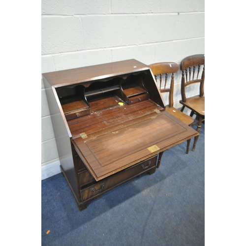 1330 - A PLYWOOD TOMBOLA, along with a mahogany bureau, and two chairs (condition report: chips to tombola)... 