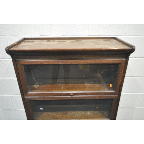 1334 - AN EARLY 20TH CENTURY OAK THREE TIER SECTIONAL BOOKCASE, with glazed hide and fall doors, width 87cm... 