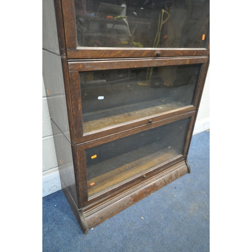 1334 - AN EARLY 20TH CENTURY OAK THREE TIER SECTIONAL BOOKCASE, with glazed hide and fall doors, width 87cm... 