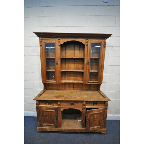 1336 - A 19TH CENTURY PINE DRESSER, the later top with arrangement of cupboards flanking open shelves, over... 