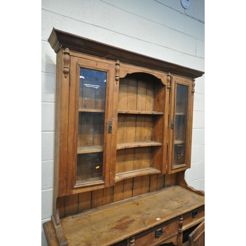 1336 - A 19TH CENTURY PINE DRESSER, the later top with arrangement of cupboards flanking open shelves, over... 