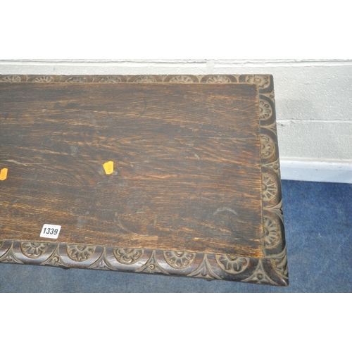 1339 - A GEORGIAN CARVED OAK RECTANGULAR TABLE, with a lunette carved frieze, united by a box stretcher, wi... 