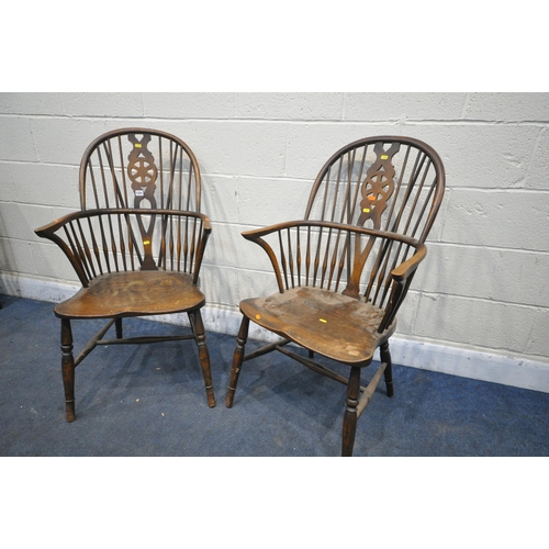 1341 - A PAIR EARLY 20TH CENTURY ELM AND BEECH WINDSOR ARMCHAIRS, the spindled hoop back with a wheel back ... 