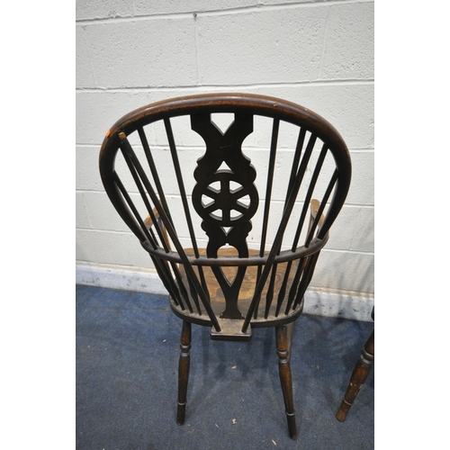 1341 - A PAIR EARLY 20TH CENTURY ELM AND BEECH WINDSOR ARMCHAIRS, the spindled hoop back with a wheel back ... 