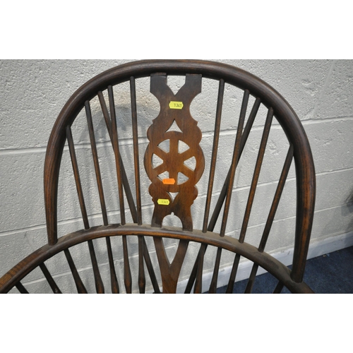 1341 - A PAIR EARLY 20TH CENTURY ELM AND BEECH WINDSOR ARMCHAIRS, the spindled hoop back with a wheel back ... 