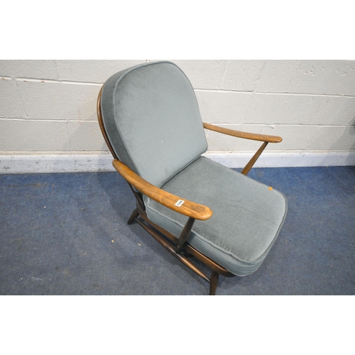 1344 - AN ERCOL MODEL 335 ARMCHAIR, with a Prince of Wales back, and loose cushions (condition report: worn... 