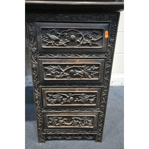 1353 - A 19TH CENTURY EBONISED ROSEWOOD CHINESE BOOKCASE ABOVE DESK, heavily carved throughout with dragons... 