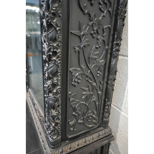 1353 - A 19TH CENTURY EBONISED ROSEWOOD CHINESE BOOKCASE ABOVE DESK, heavily carved throughout with dragons... 