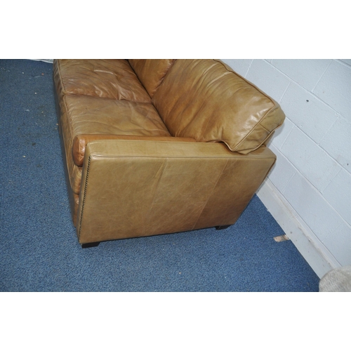 1355 - A HALO LIVING LEATHER TWO SEAT SOFA light brown in colour with two roll cushions width 182cm x depth... 