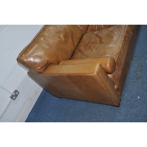 1355 - A HALO LIVING LEATHER TWO SEAT SOFA light brown in colour with two roll cushions width 182cm x depth... 