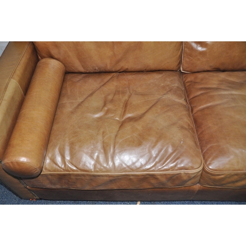 1355 - A HALO LIVING LEATHER TWO SEAT SOFA light brown in colour with two roll cushions width 182cm x depth... 