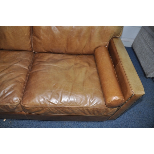 1355 - A HALO LIVING LEATHER TWO SEAT SOFA light brown in colour with two roll cushions width 182cm x depth... 