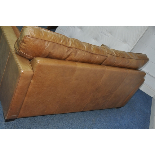 1355 - A HALO LIVING LEATHER TWO SEAT SOFA light brown in colour with two roll cushions width 182cm x depth... 