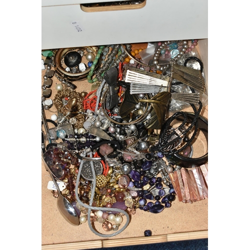 26 - TWO SETS OF STORAGE UNITS WITH A LARGE ASSORTMENT OF COSTUME JEWELLERY, each unit with six drawers c... 