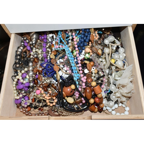 26 - TWO SETS OF STORAGE UNITS WITH A LARGE ASSORTMENT OF COSTUME JEWELLERY, each unit with six drawers c... 