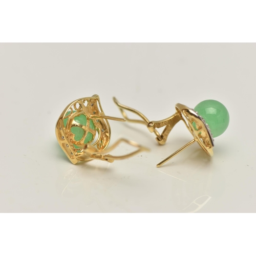 29 - A PAIR OF JADE AND DIAMOND EARRINGS, each designed as a central jade sphere within a scrolling and d... 