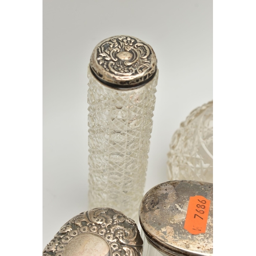 5 - A BOX OF ASSORTED SILVER LIDDED VANITY JARS, to include two round glass bottles, one with an embosse... 